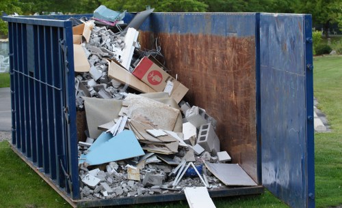 House clearance team organizing items in East London home