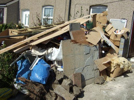 Sofa being carefully handled by removal experts in East London